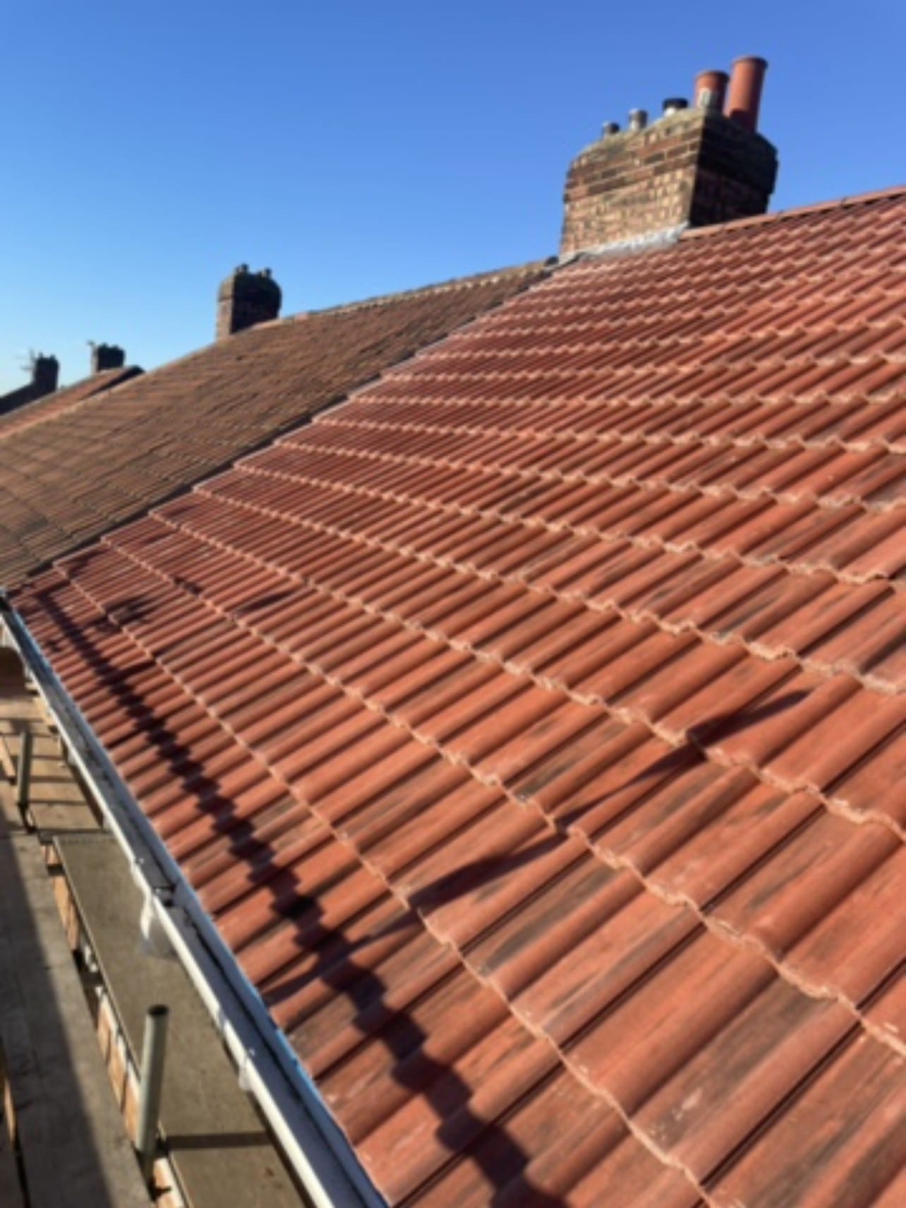 New clay tiled roof on a terraced house